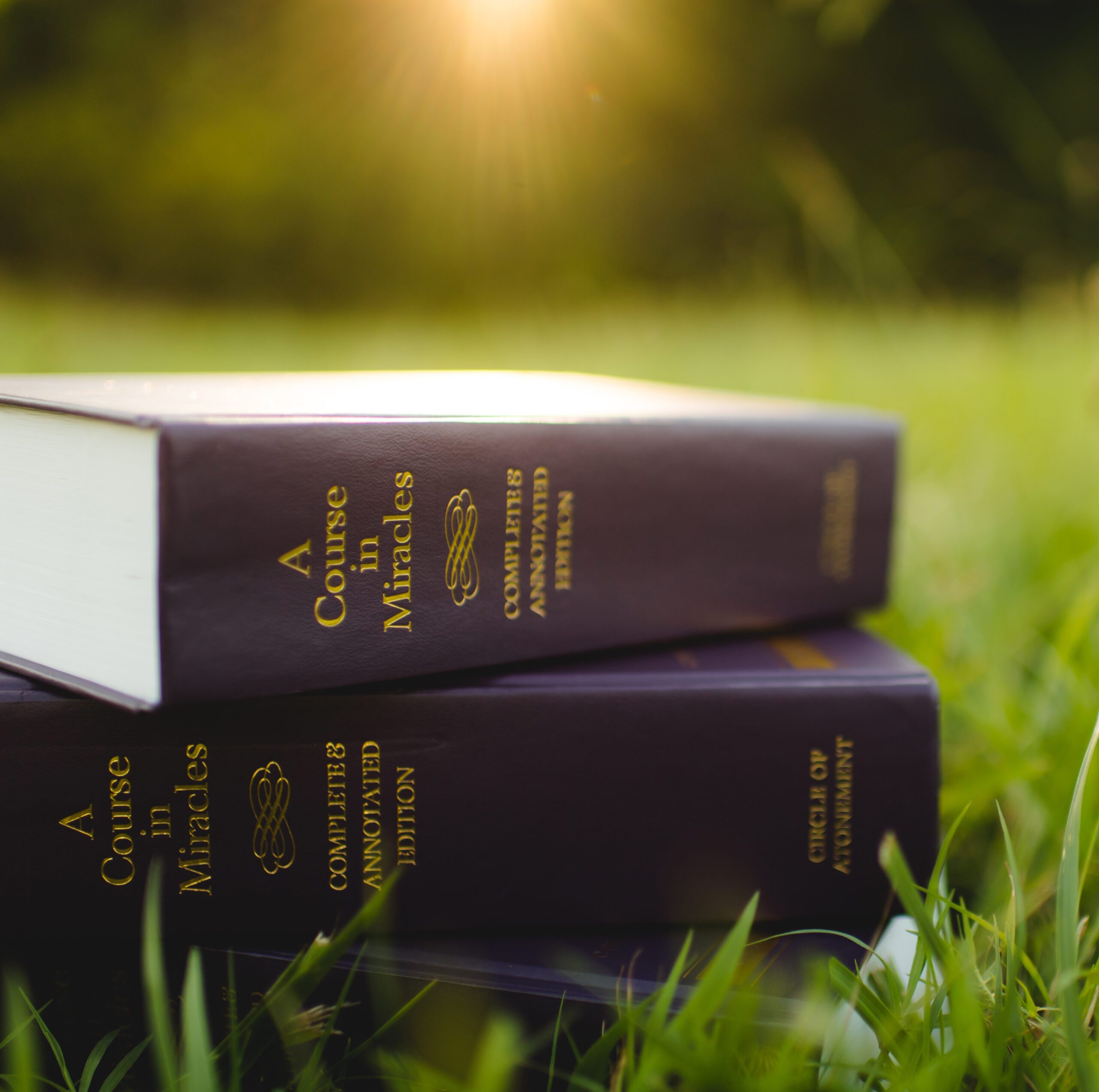 a course in miracles stacked books